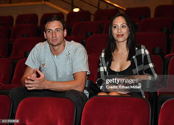 Olympian Ryan Lochte and dancer Cheryl Burke watch a private performance of "O by Cirque du Soleil" during a rehearsal for their "Dancing with the...