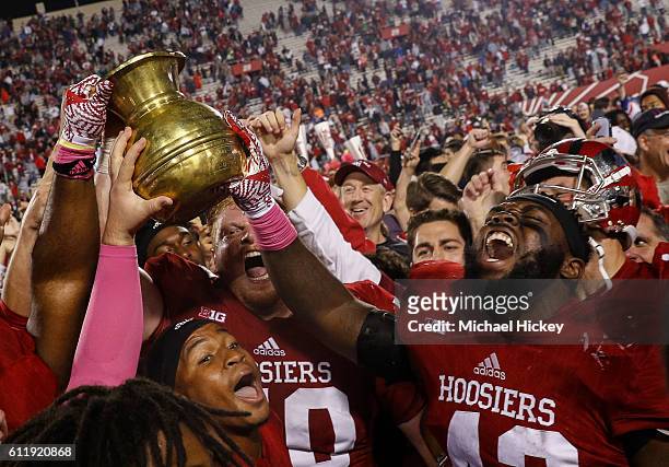 Dameon Willis Jr. #43 of the Indiana Hoosiers and members of the Indiana Hoosiers celebrate with fans after the game against the Michigan State...