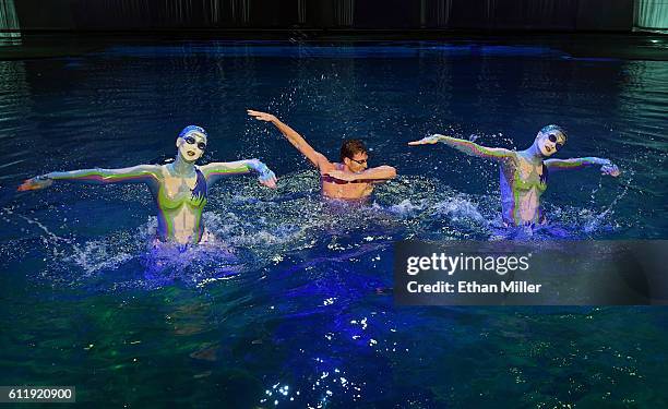 Olympian Ryan Lochte performs in the pool at the "O" theater with "O by Cirque du Soleil" performers Nayara Figueira and Christina Jones as Lochte...