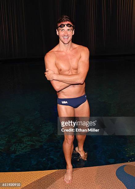 Olympian Ryan Lochte prepares to get into the pool at the "O" theater as he and dancer Cheryl Burke rehearse for their "Dancing with the Stars"...