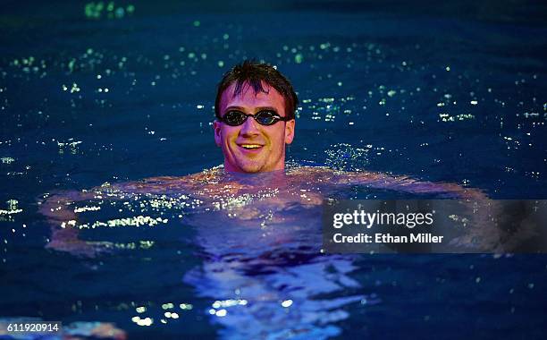 Olympian Ryan Lochte swims in the pool at the "O" theater as he and dancer Cheryl Burke rehearse for their "Dancing with the Stars" performance with...