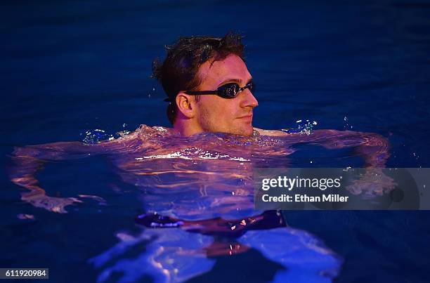 Olympian Ryan Lochte swims in the pool at the "O" theater as he and dancer Cheryl Burke rehearse for their "Dancing with the Stars" performance with...