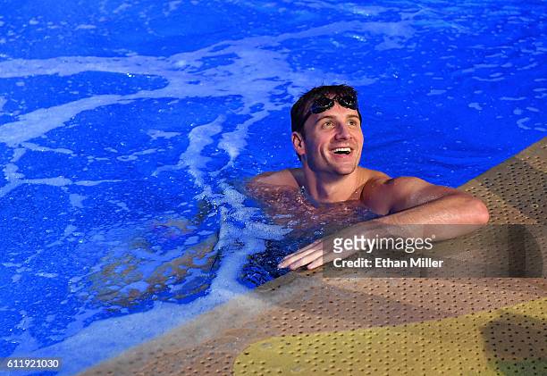 Olympian Ryan Lochte swims in the pool at the "O" theater as he and dancer Cheryl Burke rehearse for their "Dancing with the Stars" performance with...