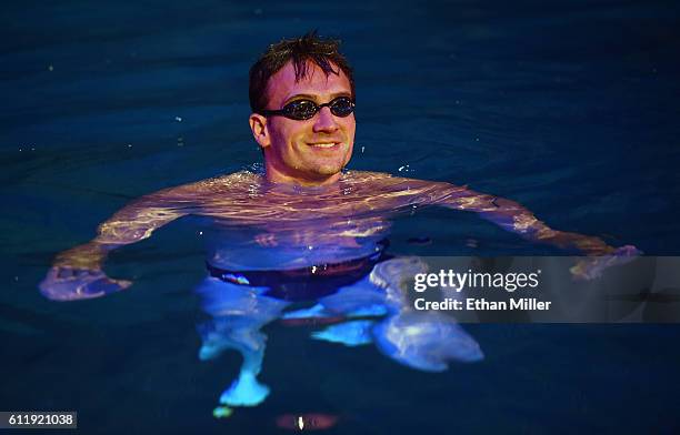 Olympian Ryan Lochte swims in the pool at the "O" theater as he and dancer Cheryl Burke rehearse for their "Dancing with the Stars" performance with...