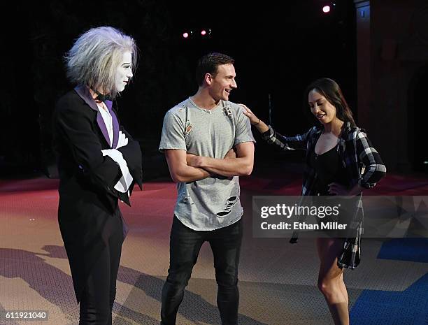 By Cirque du Soleil" performer Benedikt Negro as the character Le Vieux talks with Olympian Ryan Lochte and dancer Cheryl Burke as they rehearse for...