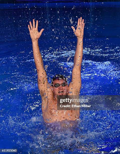 Olympian Ryan Lochte performs in the pool at the "O" theater as he and dancer Cheryl Burke rehearse for their "Dancing with the Stars" performance...