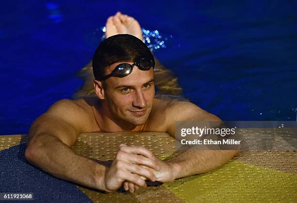 Olympian Ryan Lochte swims in the pool at the "O" theater as he and dancer Cheryl Burke rehearse for their "Dancing with the Stars" performance with...