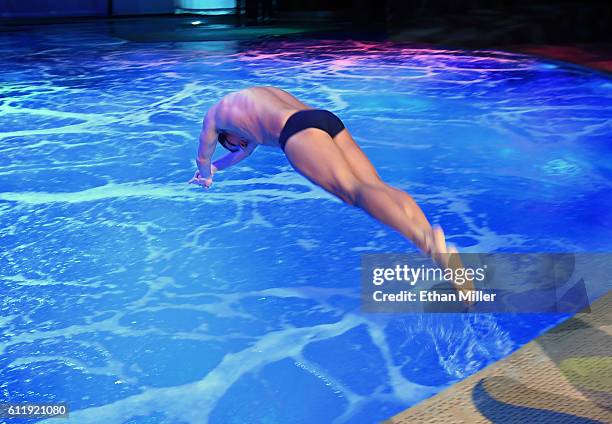 Olympian Ryan Lochte dives into the pool at the "O" theater as he and dancer Cheryl Burke rehearse for their "Dancing with the Stars" performance...