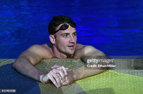 Olympian Ryan Lochte swims in the pool at the "O" theater as he and dancer Cheryl Burke rehearse for their "Dancing with the Stars" performance with...