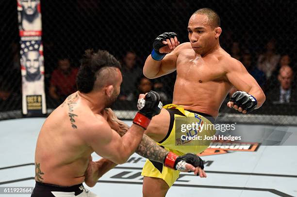 John Dodson kicks John Lineker of Brazil in their bantamweight bout during the UFC Fight Night event at the Moda Center on October 1, 2016 in...