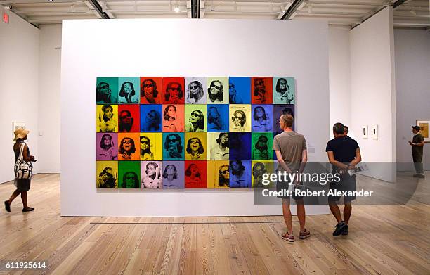 August 26, 2016: Visitors to the Whitney Museum of Art in New York City view a painting by Andy Warhol titled 'Ethel Scull 36 Times'. Warhol compled...