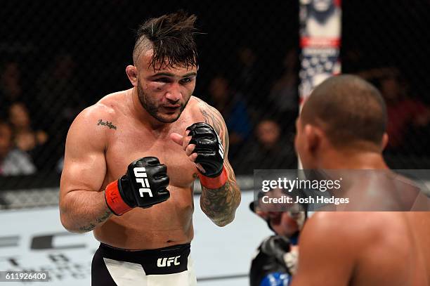 John Lineker of Brazil looks to strike John Dodson in their bantamweight bout during the UFC Fight Night event at the Moda Center on October 1, 2016...