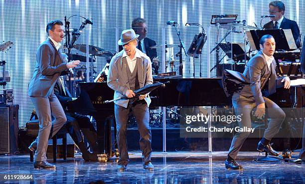 Dancer/TV personality Derek Hough performs onstage during the MPTF 95th anniversary celebration with "Hollywood's Night Under The Stars" at MPTF...