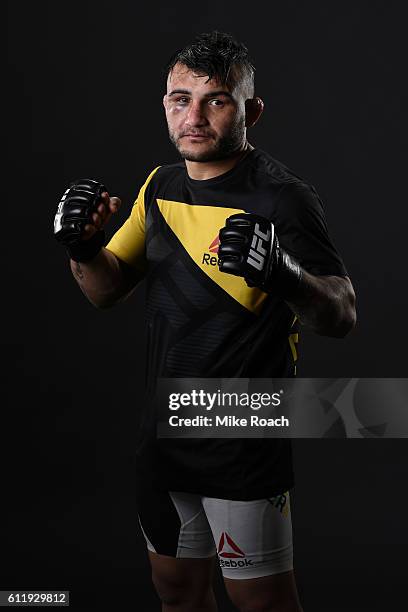 John Lineker of Brazil poses for a post fight portrait backstage after defeating John Dodson during the UFC Fight Night event at the Moda Center on...