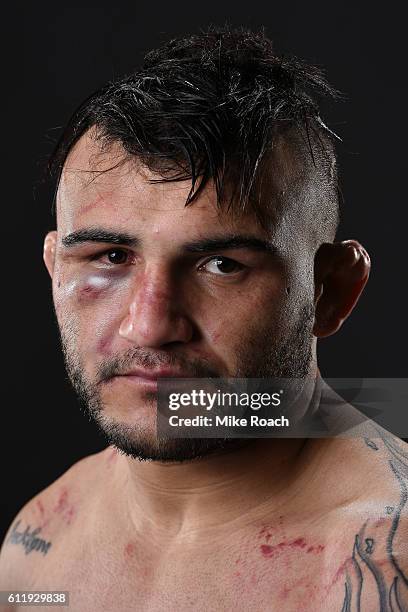 John Lineker of Brazil poses for a post fight portrait backstage after defeating John Dodson during the UFC Fight Night event at the Moda Center on...