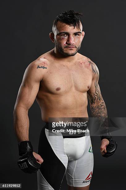 John Lineker of Brazil poses for a post fight portrait backstage after defeating John Dodson during the UFC Fight Night event at the Moda Center on...