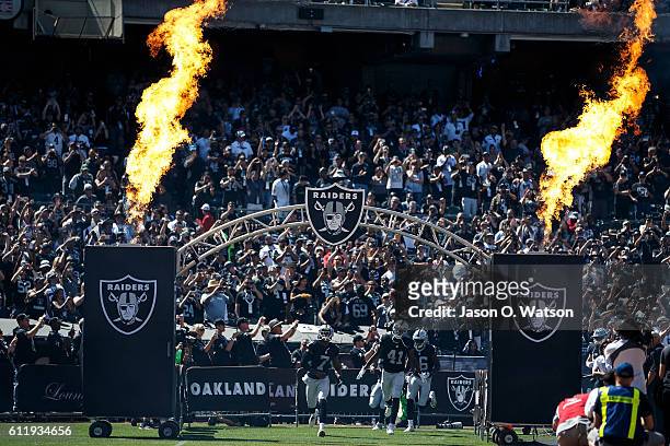 The Oakland Raiders enter the field before the game against the Atlanta Falcons at Oakland-Alameda County Coliseum on September 18, 2016 in Oakland,...