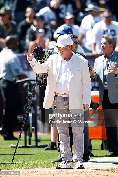 Owner Mark Davis of the Oakland Raiders stands on the sidelines before the game against the Atlanta Falcons at Oakland-Alameda County Coliseum on...