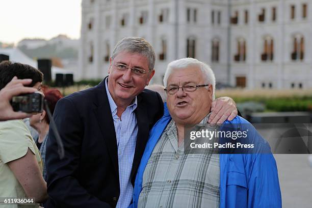Ferenc Gyurcsany, the leader of Democratic Coalition and the former Prime Minister of Hungary, poses for a photo with a supporter of the referendum...