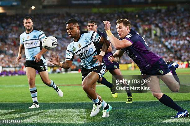 Ben Barba of the Sharks beats Tim Glasby of the Storm to the ball to save a try during the 2016 NRL Grand Final match between the Cronulla Sharks and...