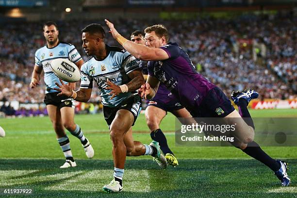 Ben Barba of the Sharks beats Tim Glasby of the Storm to the ball to save a try during the 2016 NRL Grand Final match between the Cronulla Sharks and...