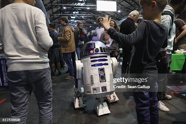 Remote-controlled R2D2 robot wanders among visitors at the 2016 Berlin Maker Faire on October 1, 2016 in Berlin, Germany. The Maker Faire combines a...