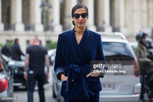 Nausheen Shah wears a velvet pajama/robe style outfit outside the Mugler show at Grand Palais on October 1, 2016 in Paris, France.