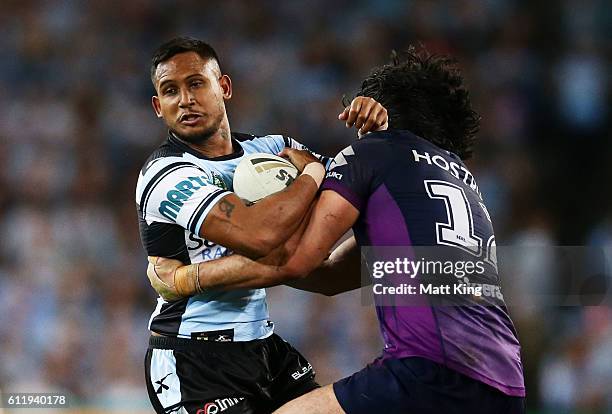 Ben Barba of the Sharks is tackled during the 2016 NRL Grand Final match between the Cronulla Sharks and the Melbourne Storm at ANZ Stadium on...