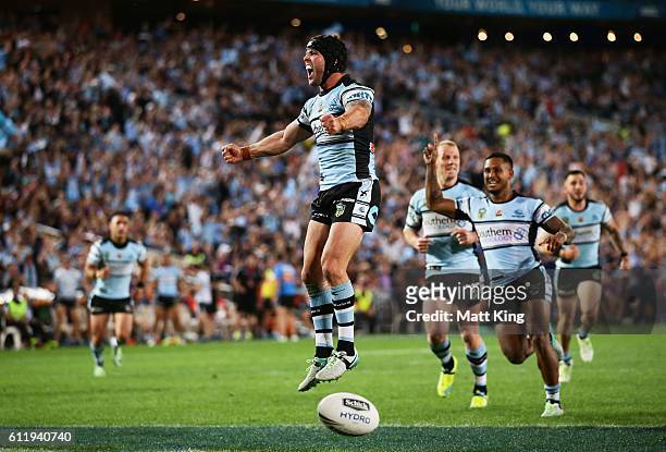 Michael Ennis of the Sharks celebrates the try to Andrew Fifita of the Sharks during the 2016 NRL Grand Final match between the Cronulla Sharks and...
