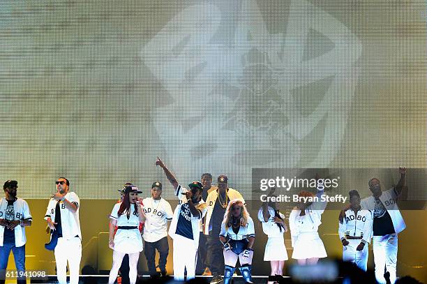 Recording artists Faith Evans , Sean "Puff Daddy' Combs , Lil Kim and Kima Raynor Dyson , Pamela Long and Keisha Spivey Epps of TOTAL perform during...