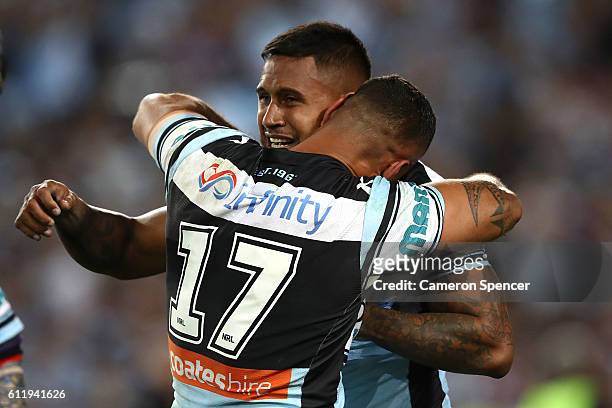 Ben Barba of the Sharks and Jason Bukuya of the Sharks celebrate winning the 2016 NRL Grand Final match between the Cronulla Sharks and the Melbourne...