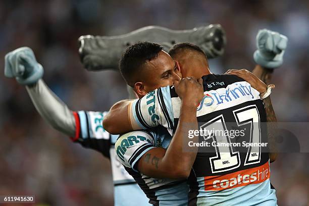 Ben Barba of the Sharks and Jason Bukuya of the Sharks celebrate winning the 2016 NRL Grand Final match between the Cronulla Sharks and the Melbourne...