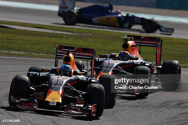 Daniel Ricciardo of Australia driving the Red Bull Racing Red Bull-TAG Heuer RB12 TAG Heuer leads Max Verstappen of the Netherlands driving the Red...