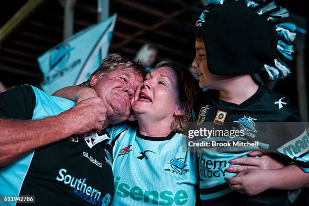 Cronulla Sharks fans at Southern Cross Group Stadium celebrate the Sharks' victory in the 2016 NRL Grand Final on October 2, 2016 in Sydney,...