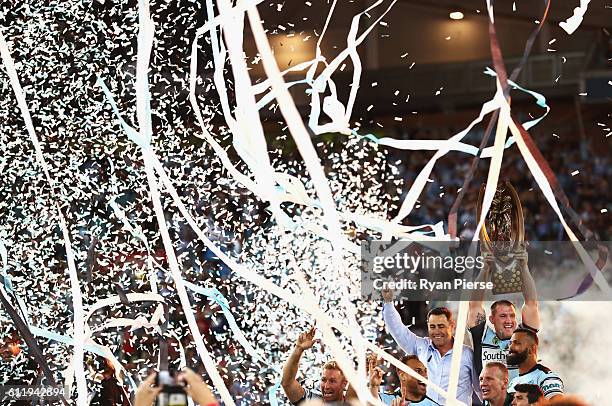 Paul Gallen of the Sharks lifts The Provan-Summons Trophy during the 2016 NRL Grand Final match between the Cronulla Sutherland Sharks and the...