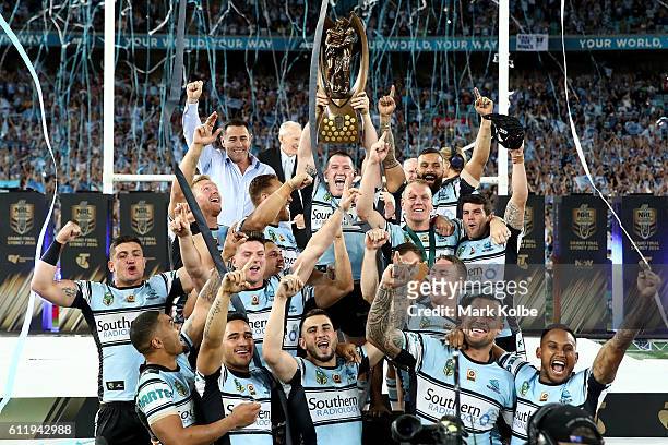 The Sharks celebrate with the Premiership Trophy after winning the 2016 NRL Grand Final match between the Cronulla Sharks and the Melbourne Storm at...