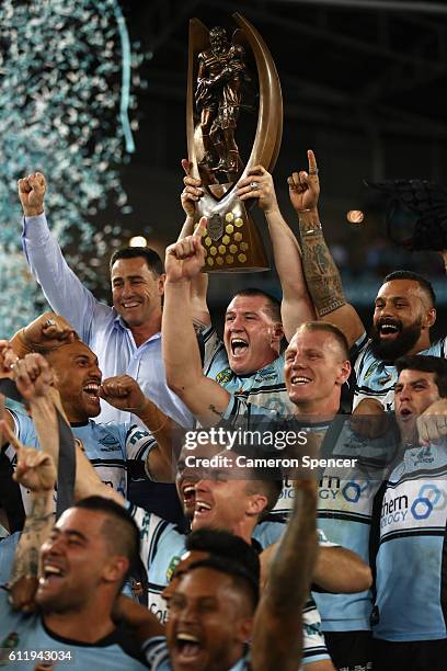 Sharks captain, Paul Gallen celebrates with team mates after winning the 2016 NRL Grand Final match between the Cronulla Sharks and the Melbourne...