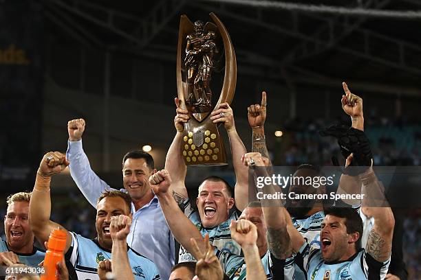 Sharks captain, Paul Gallen celebrates with team mates after winning the 2016 NRL Grand Final match between the Cronulla Sharks and the Melbourne...