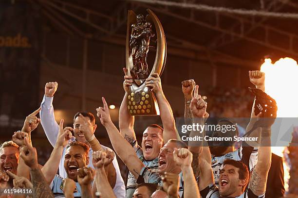 Sharks captain, Paul Gallen celebrates with team mates after winning the 2016 NRL Grand Final match between the Cronulla Sharks and the Melbourne...