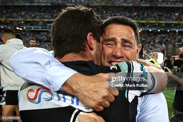 Sharks coach, Shane Flanagan celebrates with Michael Ennis of the Sharks after winning the 2016 NRL Grand Final match between the Cronulla Sharks and...