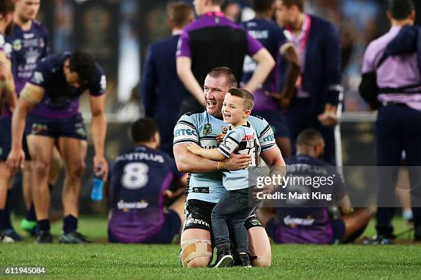 Sharks captain Paul Gallen celebrates with his son Cody Gallen after victory in the 2016 NRL Grand Final match between the Cronulla Sharks and the...