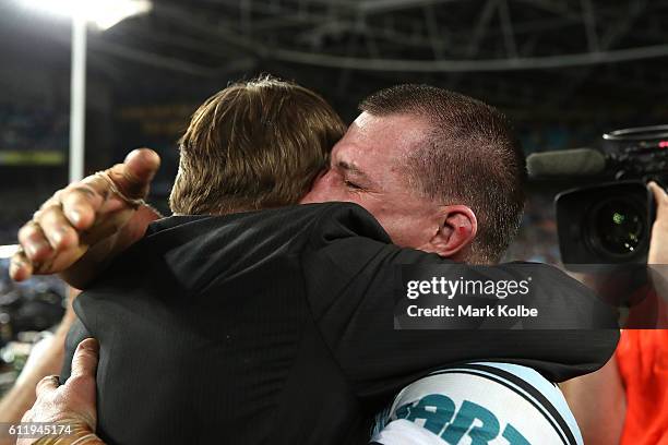 Paul Gallen of the Sharks celebrates with Andrew Ettingshausen after winning the 2016 NRL Grand Final match between the Cronulla Sharks and the...