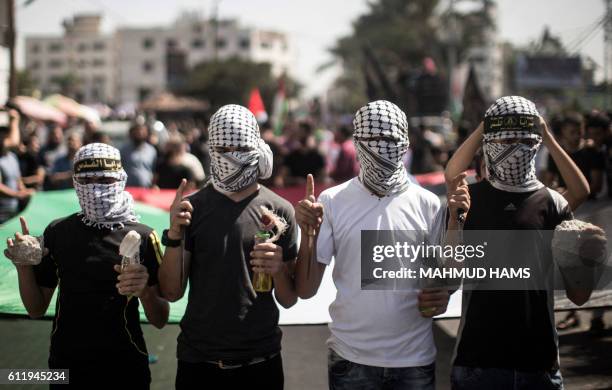 Palestinian supporters of the Islamic Jihad Movement take part in a demonstration marking the first anniversary of the so-called wave of Palestinian...