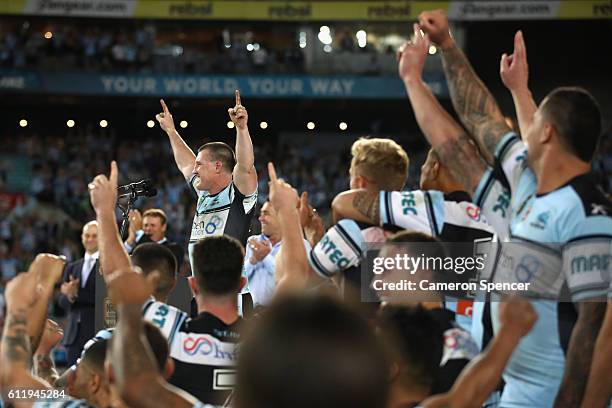 Sharks captain, Paul Gallen celebrates with team mates after winning the 2016 NRL Grand Final match between the Cronulla Sharks and the Melbourne...