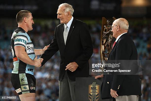 Sharks captain, Paul Gallen shakes hands with Norm Provan and Arthur Summons after winning the 2016 NRL Grand Final match between the Cronulla Sharks...