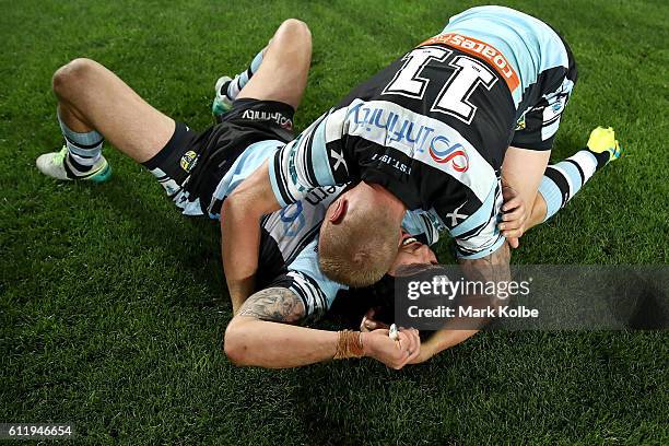 Michael Ennis of the Sharks and Luke Lewis of the Sharks celebrate winning the 2016 NRL Grand Final match between the Cronulla Sharks and the...