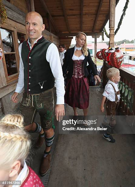 Arjen Robben of FC Bayern Muenchen, his wife Bernadien Eillert and their children attend the Oktoberfest beer festival at Kaefer Wiesenschaenke tent...