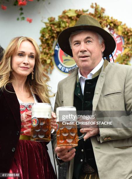 Bayern Munich's Italian headcoach Carlo Ancelotti and his wife Mariann Barrena McClay pose during the traditional visit of FC Bayern Munich at the...