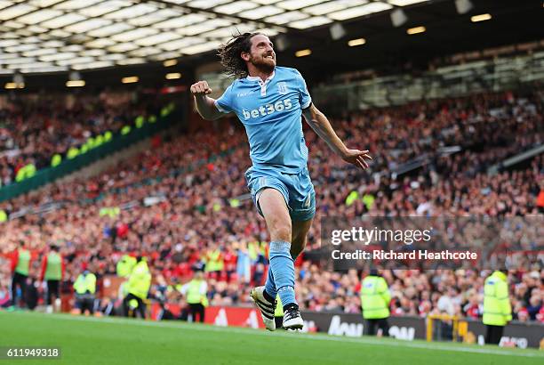 Joe Allen of Stoke City celebrates scoring his sides first goal during the Premier League match between Manchester United and Stoke City at Old...