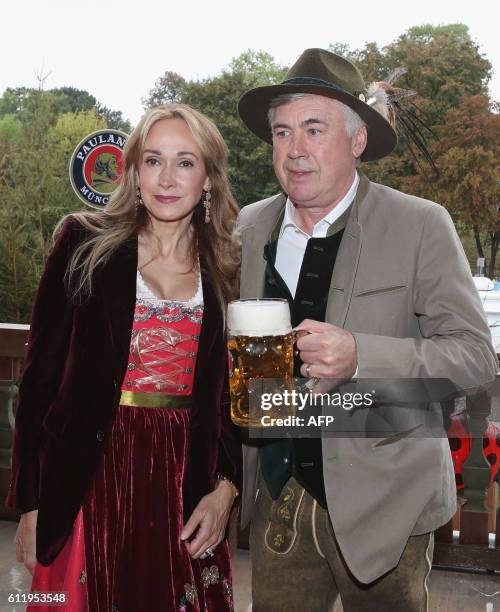 Bayern Munich's Italian head coach Carlo Ancelotti and his wife Mariann Barrena McClay pose during the traditional visit of FC Bayern Munich at the...